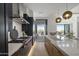 Modern kitchen with island, stainless steel appliances, and patio access at 37200 N Cave Creek Rd # 2120, Scottsdale, AZ 85262