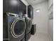 Laundry room with washer, dryer, and ample storage at 37200 N Cave Creek Rd # 2120, Scottsdale, AZ 85262