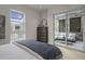Bedroom with queen bed and access to private patio at 37200 N Cave Creek Rd # 2120, Scottsdale, AZ 85262