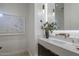 Stylish powder room with floating vanity, modern faucet, and large mirror at 37200 N Cave Creek Rd # 2120, Scottsdale, AZ 85262