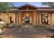 Elegant home entrance with a central fountain and inviting patio seating at 8510 E Tecolote Cir, Scottsdale, AZ 85266