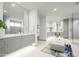 Elegant Primary bathroom with dual vanity, soaking tub, walk-in shower at 37200 N Cave Creek Rd # 1009, Scottsdale, AZ 85262