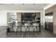 Stylish kitchen boasts an island with bar seating, dark countertops, and modern appliances at 37200 N Cave Creek Rd # 1009, Scottsdale, AZ 85262