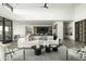 Luxury great room with wet bar, wine storage, and open floor plan at 37200 N Cave Creek Rd # 1009, Scottsdale, AZ 85262