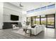 Great room with fireplace and large windows showcasing mountain views at 37200 N Cave Creek Rd # 1009, Scottsdale, AZ 85262
