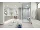 Modern main bathroom with a walk-in shower, freestanding tub, and dual vanities at 37200 N Cave Creek Rd # 1009, Scottsdale, AZ 85262