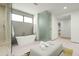Walk-in shower and spa-like tub in a luxurious and bright bathroom at 37200 N Cave Creek Rd # 1009, Scottsdale, AZ 85262
