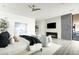 Modern Primary bedroom with fireplace, TV, and private patio access at 37200 N Cave Creek Rd # 1009, Scottsdale, AZ 85262