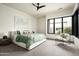 Bright bedroom with a king-size bed, large window, and sitting area at 37200 N Cave Creek Rd # 1009, Scottsdale, AZ 85262