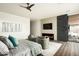 Modern bedroom with fireplace and access to backyard patio at 37200 N Cave Creek Rd # 1009, Scottsdale, AZ 85262