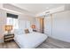 Bedroom with a queen bed and sliding barn doors at 3131 N Central Ave # 6021, Phoenix, AZ 85012