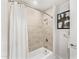 Clean bathroom with a tub, shower, and modern tile at 3131 N Central Ave # 5018, Phoenix, AZ 85012