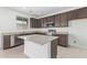 Modern kitchen with granite island and stainless steel appliances at 701 S Del Rancho --, Mesa, AZ 85208