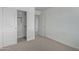 Bedroom with a large closet and neutral colored carpeting at 701 S Del Rancho --, Mesa, AZ 85208
