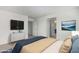 Spacious bedroom with TV, dresser, and ensuite bathroom access at 701 S Del Rancho --, Mesa, AZ 85208