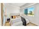 Bright bedroom with a queen bed, city view, and modern decor at 3131 N Central Ave # 4015, Phoenix, AZ 85012