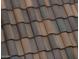 Close-up view of a roof showcasing the multi-toned, Spanish-style clay tiles at 1928 W Big Sky Ln, Queen Creek, AZ 85144