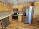Kitchen with stainless steel appliances and wood cabinets at 650 N Hawes Rd # 4829, Mesa, AZ 85207