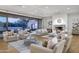 Elegant living room with hardwood floors, a fireplace, and access to a patio at 6940 E Indian Bend Rd, Paradise Valley, AZ 85253