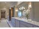 Elegant bathroom with double vanity, large mirror, and walk-in closet at 6940 E Indian Bend Rd, Paradise Valley, AZ 85253