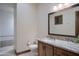 Elegant bathroom with granite countertop and large mirror at 6940 E Indian Bend Rd, Paradise Valley, AZ 85253