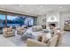 Large living room with fireplace and access to backyard at 6940 E Indian Bend Rd, Paradise Valley, AZ 85253