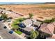 Two-story house with a large backyard and a three-car garage at 1327 E Judi Dr, Casa Grande, AZ 85122