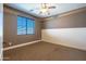 Well-lit bedroom, featuring carpet and wainscoting at 1327 E Judi Dr, Casa Grande, AZ 85122
