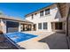 Home features a large backyard with a covered patio and a blue basketball court at 1327 E Judi Dr, Casa Grande, AZ 85122