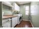 Laundry room with built-in shelving and cabinets at 1327 E Judi Dr, Casa Grande, AZ 85122