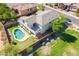 Aerial view of house, pool, putting green, and surrounding area at 1327 E Judi Dr, Casa Grande, AZ 85122