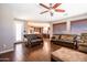 Comfortable living room with leather sofas and a view into the kitchen at 1327 E Judi Dr, Casa Grande, AZ 85122