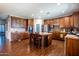 Large kitchen with a center island, wood cabinets, and granite counters at 1327 E Judi Dr, Casa Grande, AZ 85122