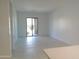 Bright and airy living room with tile floors and sliding glass doors at 846 N Pueblo Dr # 134, Casa Grande, AZ 85122