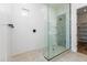 Walk-in shower with geometric tile and glass enclosure at 7583 W Gelding Dr, Peoria, AZ 85381