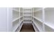 Walk-in pantry with ample shelving for storage at 7583 W Gelding Dr, Peoria, AZ 85381