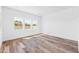 Spacious bedroom with hardwood floors and large windows at 7583 W Gelding Dr, Peoria, AZ 85381