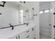 Double vanity bathroom with modern fixtures and a separate tub at 7583 W Gelding Dr, Peoria, AZ 85381