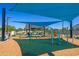 Modern playground equipment under shaded play area at 7583 W Gelding Dr, Peoria, AZ 85381