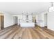 Open concept kitchen with island, white cabinets, and stainless steel appliances at 7583 W Gelding Dr, Peoria, AZ 85381