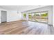 Bright living room with hardwood floors and sliding glass doors leading to backyard at 7583 W Gelding Dr, Peoria, AZ 85381