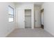Bright bedroom with carpeted floor and built-in closet at 7583 W Gelding Dr, Peoria, AZ 85381