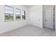 Spacious bedroom with neutral carpeting and large windows at 7583 W Gelding Dr, Peoria, AZ 85381