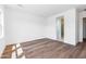 Bright bedroom with hardwood floors and ensuite bathroom access at 7583 W Gelding Dr, Peoria, AZ 85381