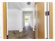 Bright entryway with herringbone floors and view to living area at 7583 W Gelding Dr, Peoria, AZ 85381