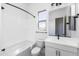 Clean bathroom with white vanity, bathtub, and toilet at 7583 W Gelding Dr, Peoria, AZ 85381