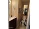 Small bathroom with toilet, sink, and vanity at 3840 N 43 Ave # 50, Phoenix, AZ 85031