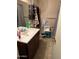 Bathroom with dark brown vanity and tiled floor at 3840 N 43 Ave # 50, Phoenix, AZ 85031