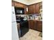 Kitchen with wood cabinets and appliances at 3840 N 43 Ave # 50, Phoenix, AZ 85031