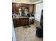 Kitchen with wood cabinets, dishwasher, and sink at 3840 N 43 Ave # 50, Phoenix, AZ 85031